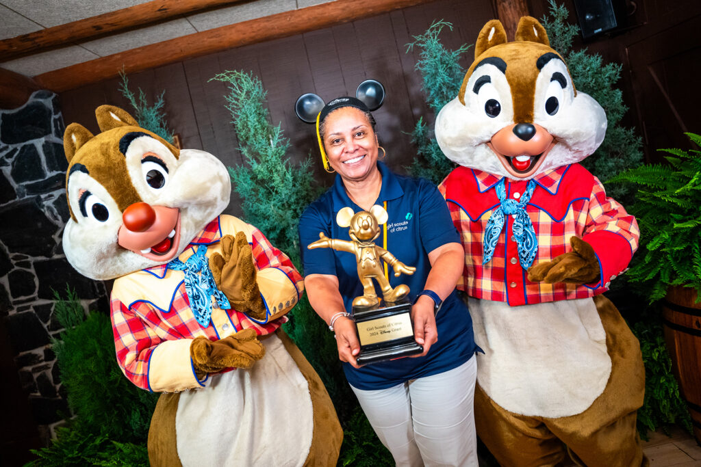 Chip and Dale pose with a Disney Grant recipient